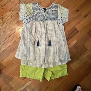 Green shorts. White top, embellished with gold thread. Medium top. 10 shorts
